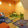 Spielzimmer mit Eisenbahn im JUFA Kempten Familien-Resort. Der Ort für kinderfreundlichen und erlebnisreichen Urlaub für die ganze Familie.