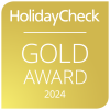 Sie sehen die Auszeichnung des Holiday Check Gold Awards für das Jahr 2024.