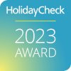 Sie sehen das Logo des HolidayCheck Award 2023.